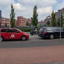 Greenwheels, taxi en scooter op rontonde in Amersfoort